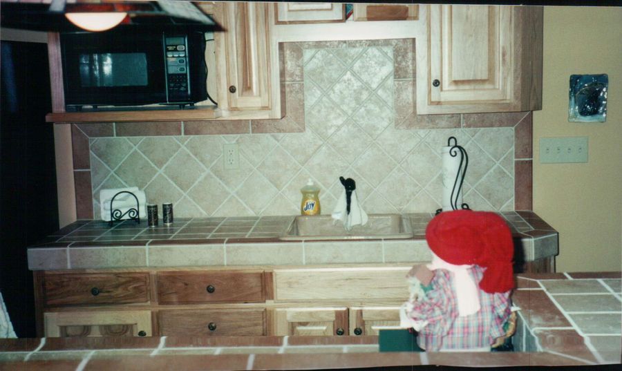 Tiled kitchen countertop with diagonal tile backsplash