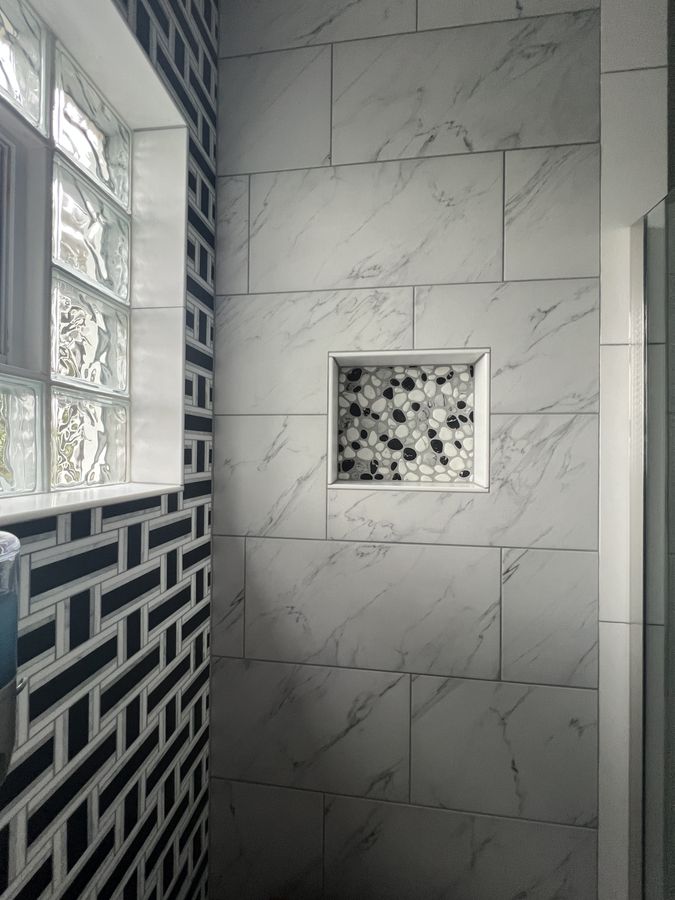 Basket weave mosaic shower wall with glass block window