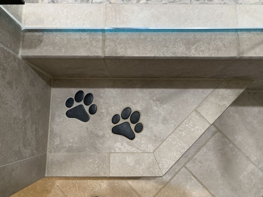 Close up of paw print mosaic set into travertine